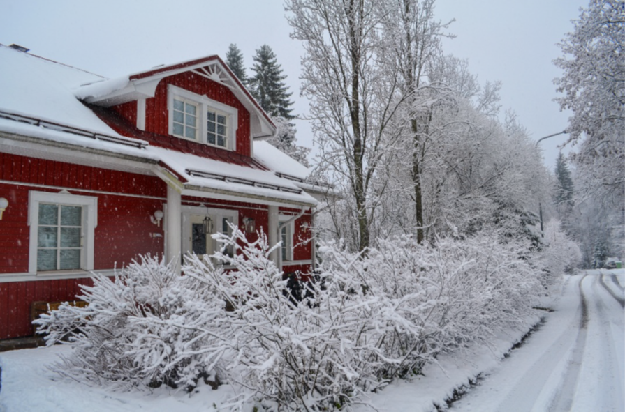 Falured house in a snowy winter landscape