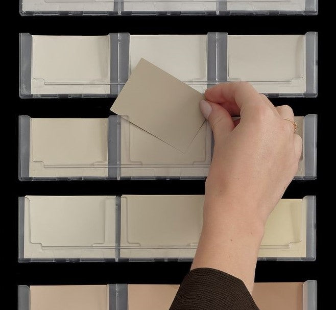 Hand holding sample of NCS Interior 84 Display