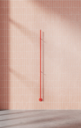 Orange towel dryer and pink background